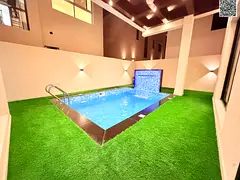 Two-story villa with a rooftop terrace and swimming pool, located close to amenities, at an exclusiv