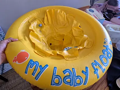 Yellow baby swim float ring with seat