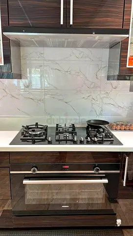 Siemens latest model IQ-500 electric oven and gass cooktop built-in black finish by had