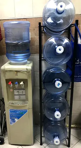 Used Water Dispenser with Extra 5 x 18L Bottles (collection)