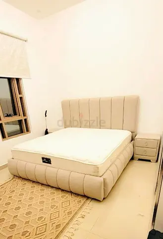 Beige Upholstered Queen Bed with Mattress and Nightstand - Good Condition