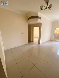 Two-bedroom apartment with a living room for annual rent in Al Nuaimiya 1, Ajman, featuring a good s