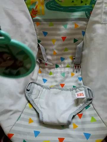 Lightly used baby bouncer/seat with harness and toy mirror