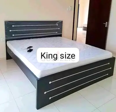 King size bed frame with mattress — dark wood, simple design