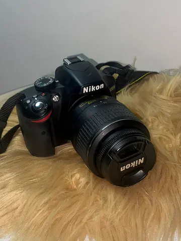 Nikon D3200 DSLR camera with lens, charger and battery