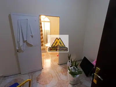 A 2-bedroom apartment with a living room for annual rent, featuring a balcony and 2 bathrooms. The apartment offers a practical layout, split AC, and