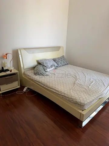 Modern cream king size bed with medical mattress, upholstered headboard and matching nightstand