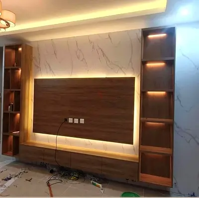 Wall-mounted entertainment unit with built-in shelves and LED lighting