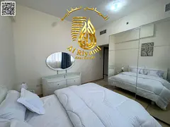 Two bedrooms and a living room, monthly rent with a balcony, including bills and parking in Al Yasmi