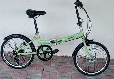 Light green Panasonic folding bike - compact city commuter
