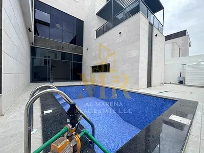 Corner villa in Al-Haliyo, 5000 sq ft, with a swimming pool, elevator, rooftop terrace, and very sp