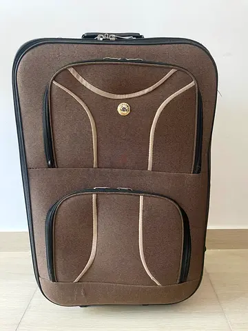 Brown soft-shell trolley suitcase with front pockets – good condition