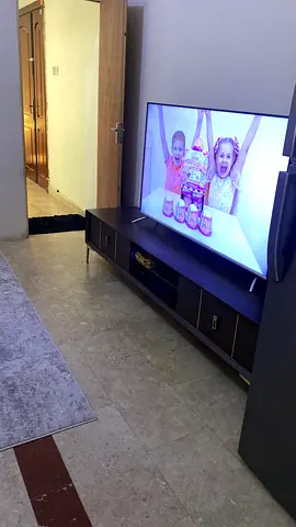 65-inch LED Smart TV in Good Condition with pure wooden console