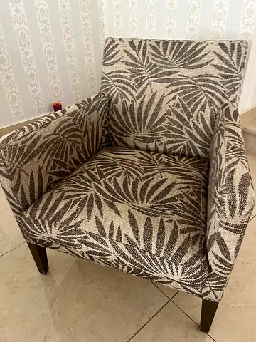 Single patterned armchair in good condition