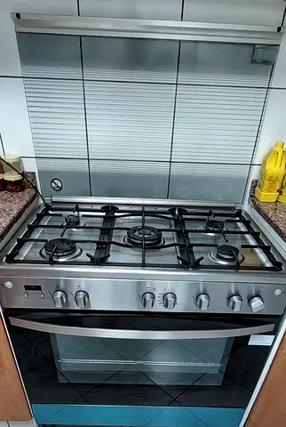 Stainless Steel 5-Burner Gas Range with Oven still under warranty