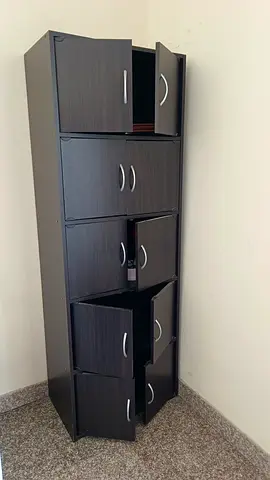 Tall dark-wood storage cabinet with multiple doors