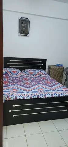 Queen Size Wooden Bed with Headboard and Storage Base - Good Condition