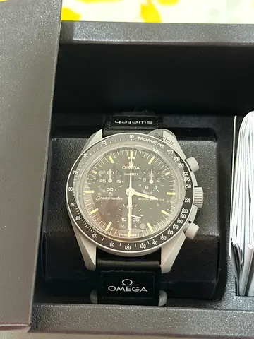 Omega swatch (mission to the moon) brand new with catalog and bill