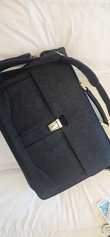 Black leather briefcase with shoulder strap — lightly used