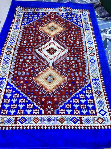 Traditional blue and brown Persian-style area rug - good condition