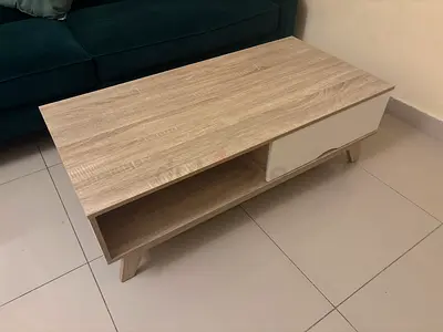 Light wood coffee table with storage drawer