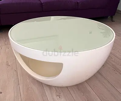 Round white modern coffee table with glass top and storage compartment - good condition