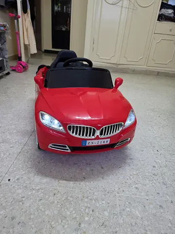 Red Battery-Powered Ride-On Car for Kids (Good Condition)