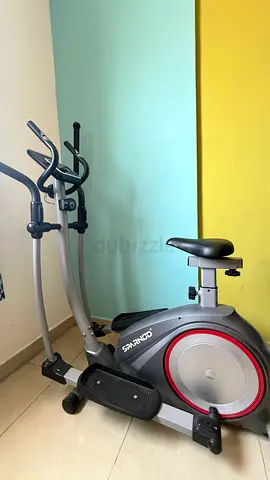 Used Sparnods Upright Exercise Bike with Elliptical Handles - Good Condition