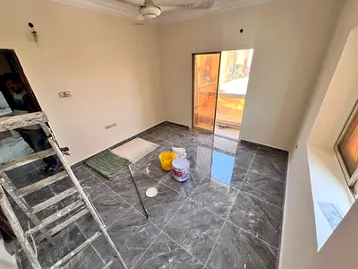 Two bedrooms and a living room in Al Rawda 3, Al Salam Street, near Al Muwaihat Roundabout.