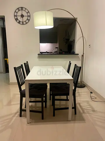 IKEA White Dining Table with 4 Black IKEA Chairs | RRP AED 600 | Used Condition | 125L x 75W x 74H