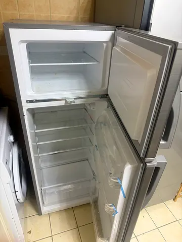 Used top-freezer refrigerator in good working condition