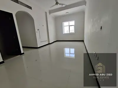 Two bedrooms and a living room for annual rent in Al Rawda 3, Sheikh Ammar Street, Ajman. Central air conditioning, two bathrooms, close to amenities,
