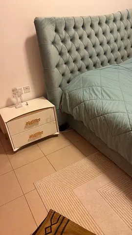 Light teal upholstered California king size bed with tufted headboard - excellent condition