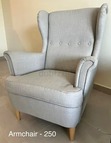 Light grey wingback armchair with wooden legs - Good condition