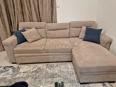 Light beige L-shaped sectional sofa with chaise, good condition