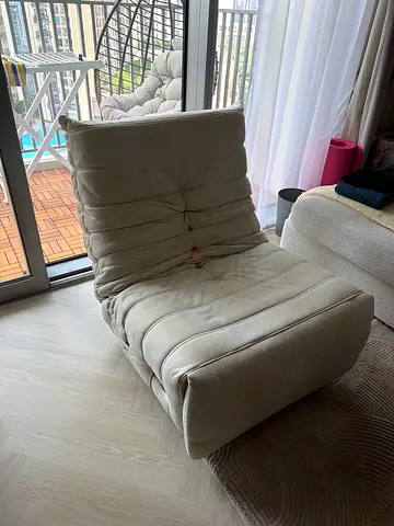 Comfortable beige lounge chair / accent chair in good condition