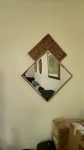 Decorative geometric wall mirror with carved wooden frame
