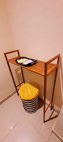 Minimal Bamboo stand with light towel tray and ikea storage basket.