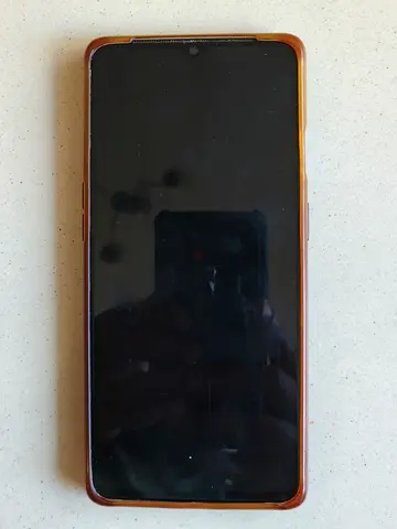Used Android smartphone with protective case - good working condition.