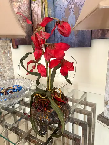 Ornate decorative vase with red artificial orchids - ready to display
