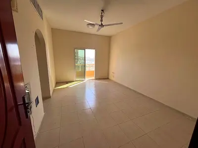 1BR apartment for rent in Al Mowaihat 2 Ajman balcony separate kitchen AED 28,000 yearly 6 cheques
