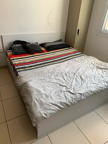 Queen bed frame with mattress — simple white platform set