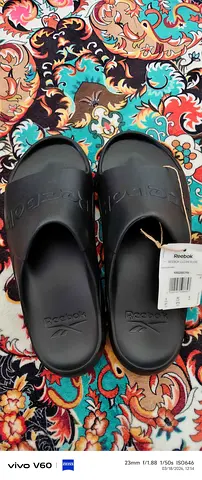 Brand new Reebok black slide sandals with tag, size available