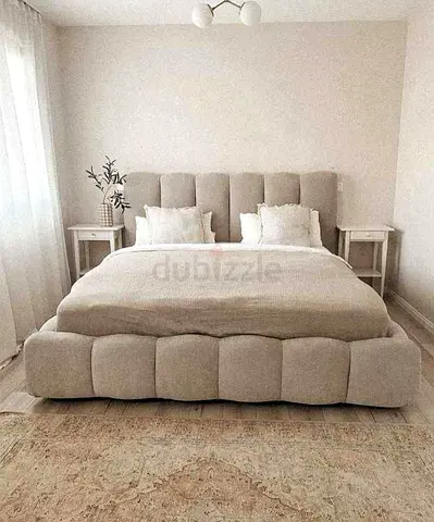 Queen upholstered platform bed with padded headboard - neutral beige
