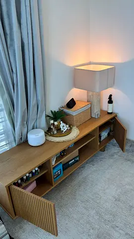 Low wooden TV console / media unit with slatted doors