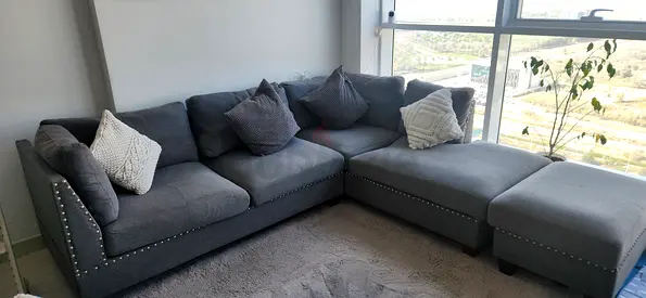 Grey L-shaped Fabric Sectional Sofa with Ottoman - Good Condition