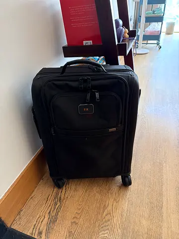 Tumi Black Carry-On Roller Luggage with Front Pocket (Good Condition)