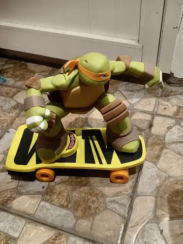 Teenage Mutant Ninja Turtles Michelangelo Figure on Skateboard - Used