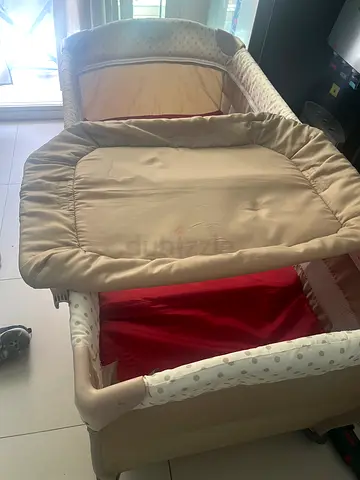 Portable baby bassinet with changing station - beige, gently used