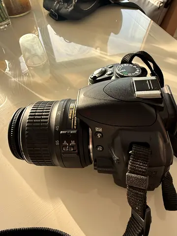 Nikon DSLR camera with 18-55mm lens - good working condition